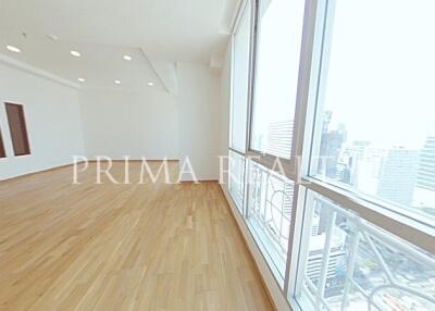 Spacious empty apartment interior with large windows and city view