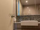 Modern bathroom interior with tiled walls and wooden vanity