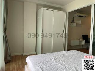 Spacious bedroom with natural light and built-in wardrobe