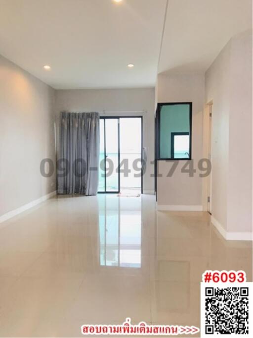 Spacious empty room with glossy tiled floor and large windows