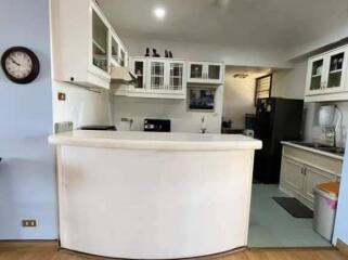 Spacious kitchen with modern appliances and white cabinetry