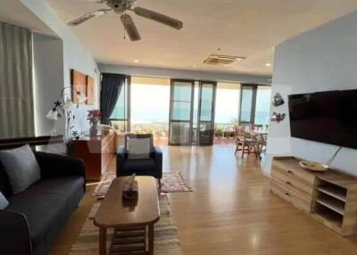 Spacious and well-lit living room with a view