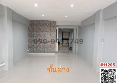 Spacious empty living room with decorative wall