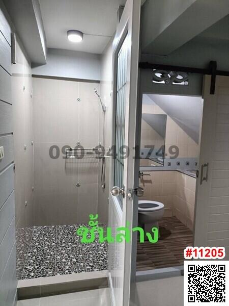 Modern bathroom with glass shower enclosure and stylish fixtures