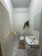 Modern white tiled bathroom with sleek fixtures