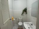 Modern white tiled bathroom with sleek fixtures
