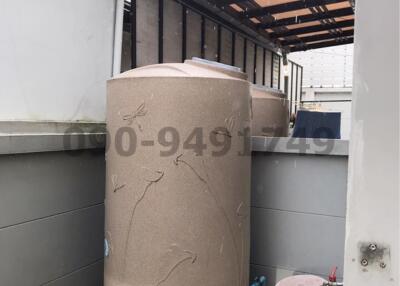 Exterior water storage tanks at residential property