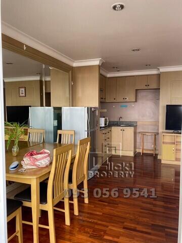 Modern kitchen with open dining area and hardwood floors