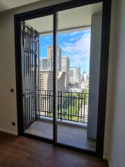 Modern bedroom with large windows overlooking the city