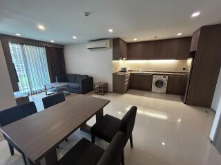 Spacious open-plan living room with kitchen and modern appliances