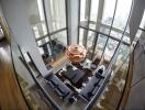 Modern living room with floor-to-ceiling windows overlooking the city