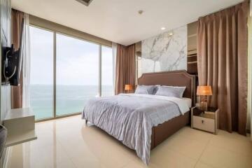 Modern bedroom with ocean view and ample natural light