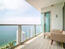 Spacious balcony with ocean view and outdoor furniture