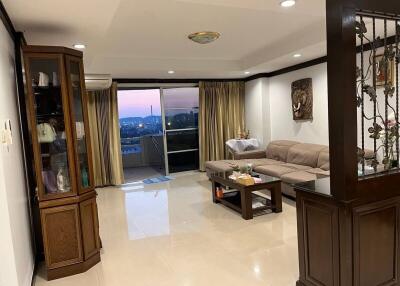 Spacious living room with city view and comfortable seating