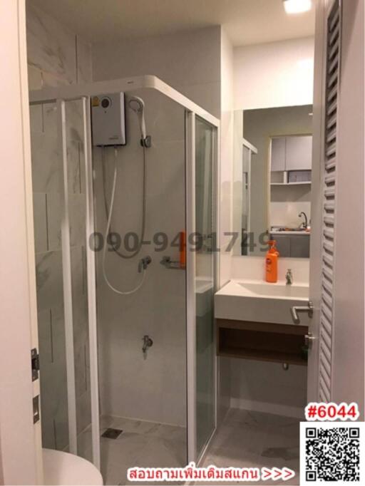 Modern bathroom with glass shower and white sink