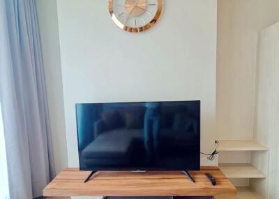 Modern living room interior with large flat-screen television