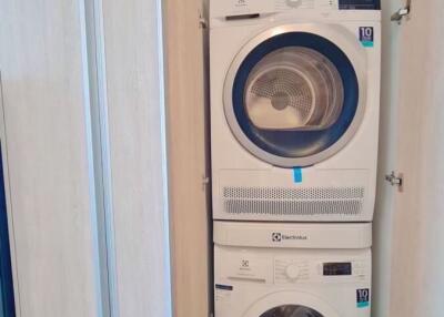 Stacked washer and dryer in a small laundry closet