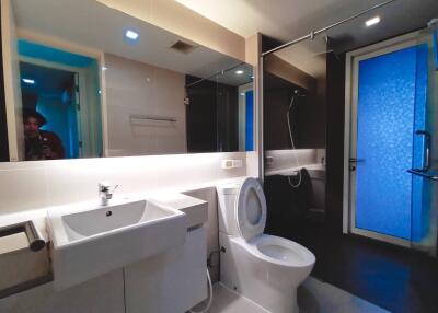 Modern bathroom interior with blue accent lighting