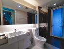 Modern bathroom interior with blue accent lighting