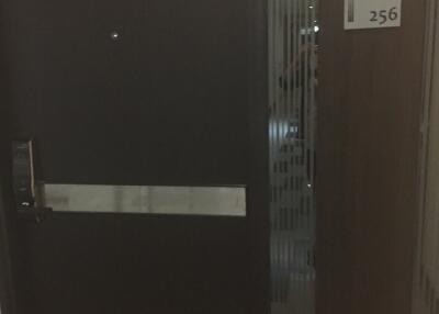 Dark image of an apartment entry door