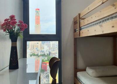 Cozy bedroom with a bunk bed and city view