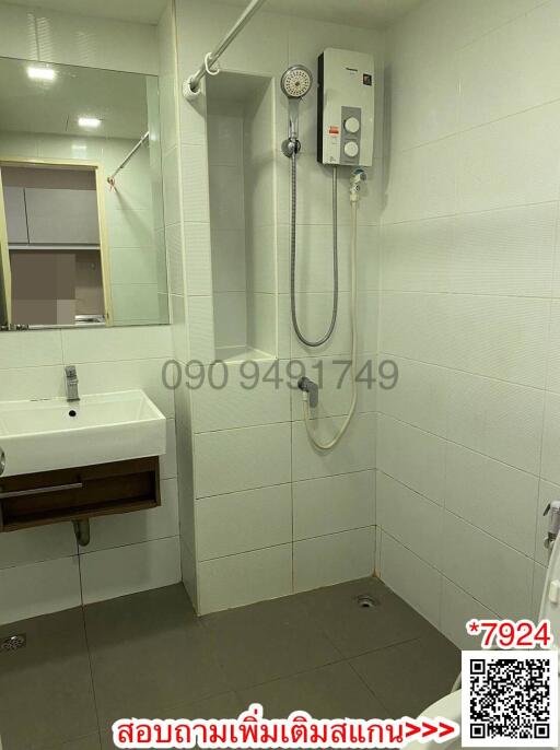 Modern bathroom with walk-in shower and wall-mounted sink