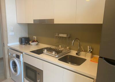 Modern kitchen with stainless steel appliances and white cabinetry