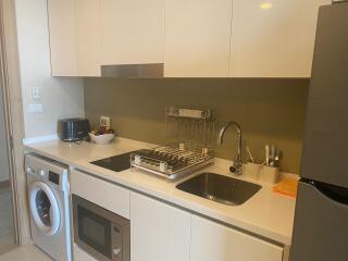 Modern kitchen with stainless steel appliances and white cabinetry