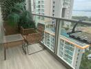 Cozy balcony with outdoor seating and a view of the surroundings