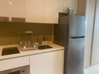 Modern kitchen with stainless steel appliances and white cabinetry