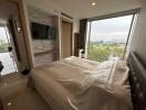 Spacious Bedroom with Natural Light and Panoramic View