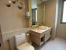 Modern bathroom with beige tiles and decorative butterflies