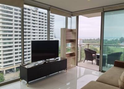 Modern living room with large windows and contemporary furniture