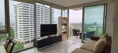 Modern living room with large windows and contemporary furniture