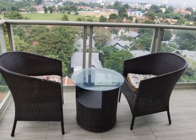 Spacious balcony with a view and outdoor seating