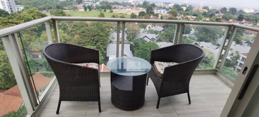 Spacious balcony with a view and outdoor seating