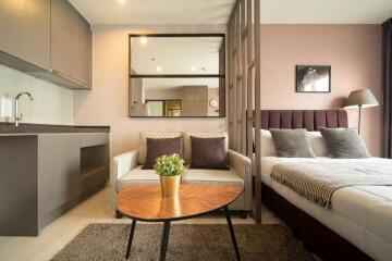 Cozy bedroom with integrated living space including a kitchenette