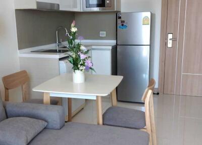 Modern kitchen with stainless steel appliances and dining area