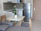 Modern kitchen with stainless steel appliances and dining area