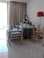 Modern living room with dining area and city view