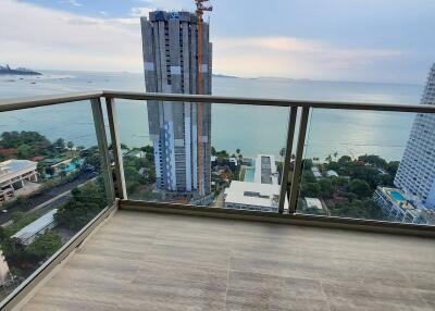 Spacious balcony with ocean view and clear sky