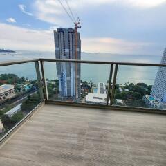 Spacious balcony with ocean view and clear sky