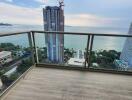 Spacious balcony with ocean view and clear sky