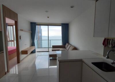 Modern living space with kitchenette and view of the ocean