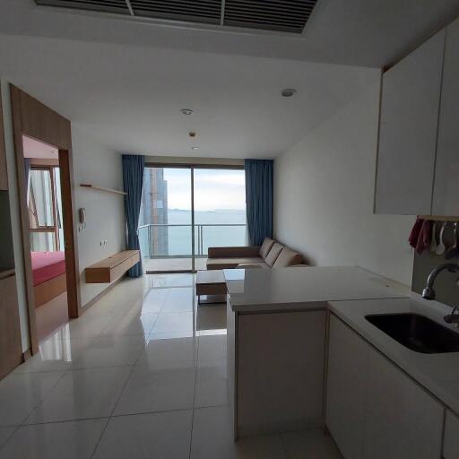 Modern living space with kitchenette and view of the ocean