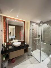 Modern bathroom with LED mirror and glass shower