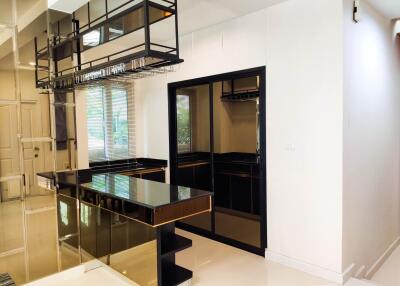 Modern kitchen with black countertops and gloss finish