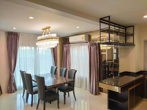 Elegant dining room with chandelier and modern furniture