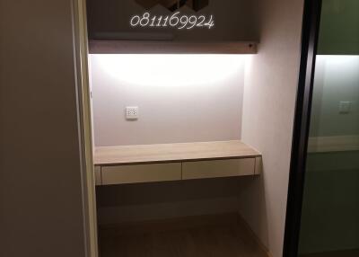 Compact entryway with built-in storage and modern lighting