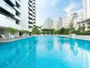 Outdoor swimming pool area in a modern residential complex